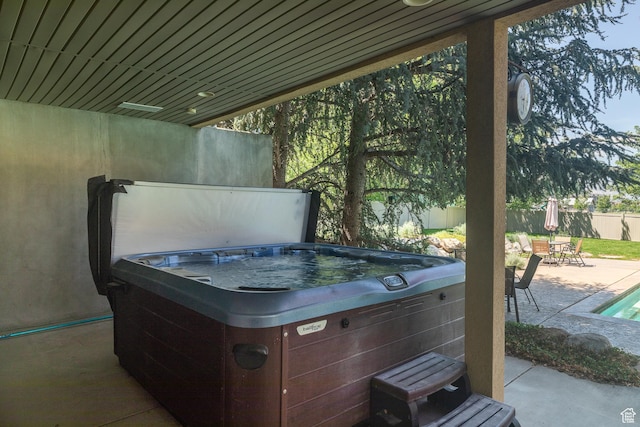 13966 S Arrow Creek Dr E, Draper, UT 84020 - view of patio featuring a hot tub and outdoor dining space
