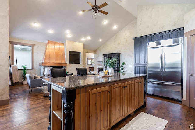 13966 S Arrow Creek Dr E, Draper, UT 84020 - kitchen with stainless steel built in refrigerator, ceiling fan, open floor plan, a center island, and high vaulted ceiling