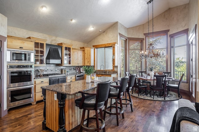13966 S Arrow Creek Dr E, Draper, UT 84020 - kitchen with custom exhaust hood, stainless steel appliances, high vaulted ceiling, a chandelier, and a kitchen island