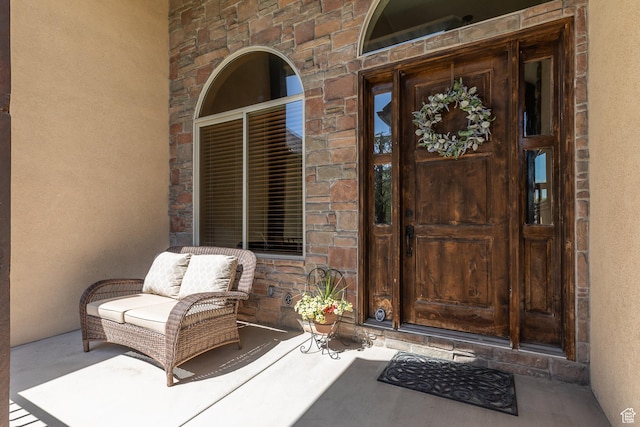 13966 S Arrow Creek Dr E, Draper, UT 84020 - doorway to property featuring stone siding and stucco siding