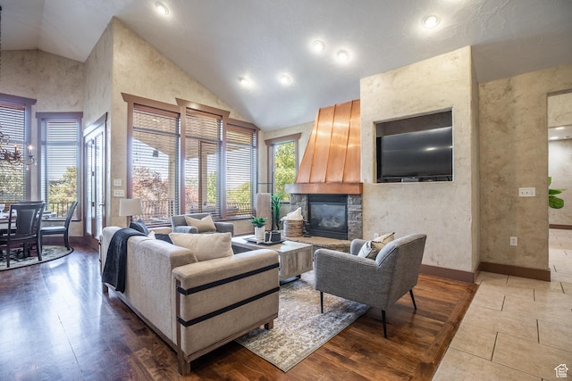 13966 S Arrow Creek Dr E, Draper, UT 84020 - living room with a stone fireplace, high vaulted ceiling, baseboards, and recessed lighting