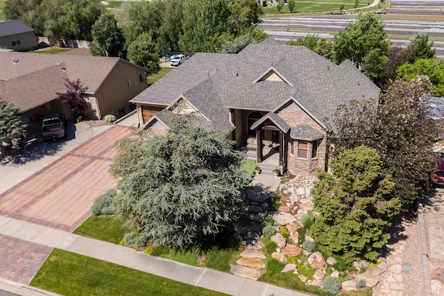 13966 S Arrow Creek Dr E, Draper, UT 84020 - view of front facade with stone siding and roof with shingles