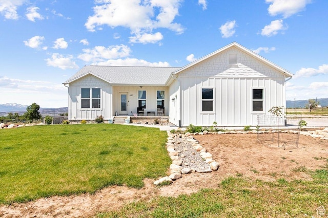687 E 200 S, Spring City, UT 84662 - rear view of house featuring board and batten siding, a lawn, and a mountain view
