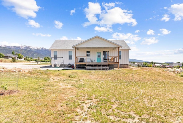 687 E 200 S, Spring City, UT 84662 - rear view of property with board and batten siding, a mountain view, a lawn, and a porch