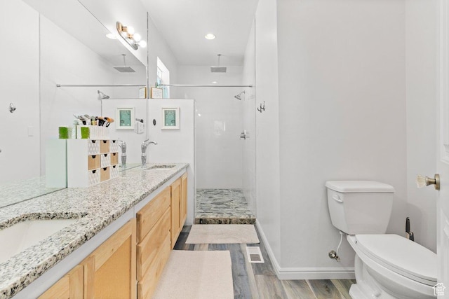 687 E 200 S, Spring City, UT 84662 - full bathroom with wood finished floors, toilet, a stall shower, and double vanity
