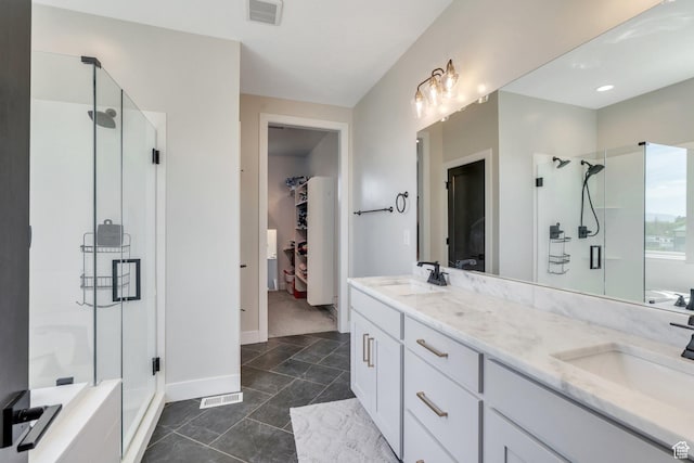1485 W 1930 N, Pleasant Grove, UT 84062 - full bathroom featuring a stall shower, double vanity, baseboards, and a walk in closet