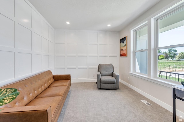 1485 W 1930 N, Pleasant Grove, UT 84062 - living area with a decorative wall, light colored carpet, recessed lighting, and baseboards