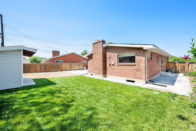 2864 N 175 E, Provo, UT 84604 - back of property featuring a patio area, brick siding, a chimney, and central AC unit