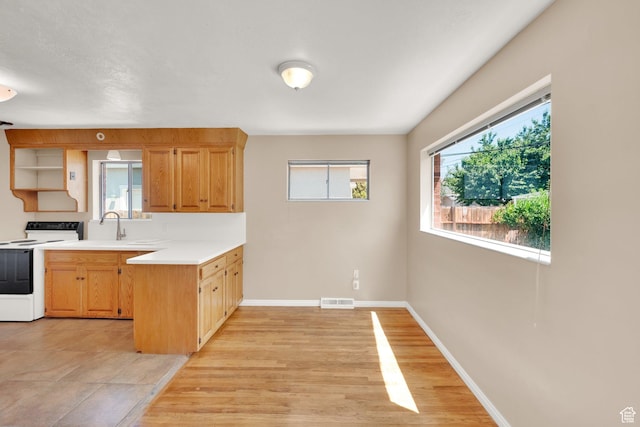 2864 N 175 E, Provo, UT 84604 - kitchen with white electric range oven, a peninsula, light countertops, baseboards, and open shelves