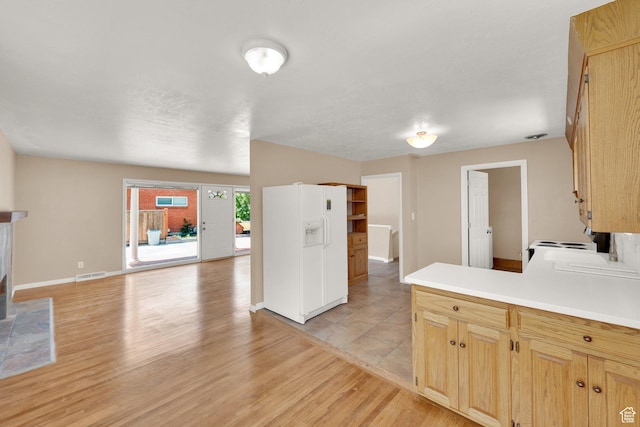 2864 N 175 E, Provo, UT 84604 - kitchen with light wood-style floors, white appliances, light countertops, baseboards, and a peninsula