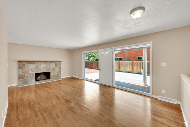 2864 N 175 E, Provo, UT 84604 - unfurnished living room with wood finished floors, a textured ceiling, and baseboards