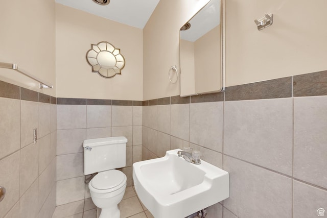 2864 N 175 E, Provo, UT 84604 - bathroom featuring tile walls, toilet, a sink, a wainscoted wall, and tile patterned flooring