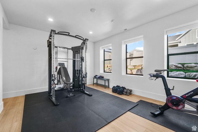 12277 S Emory Peak Cv Unit 404, Herriman, UT 84096 - exercise room featuring baseboards, wood finished floors, and recessed lighting