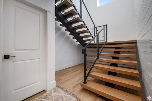 12277 S Emory Peak Cv Unit 404, Herriman, UT 84096 - staircase featuring wood finished floors and baseboards