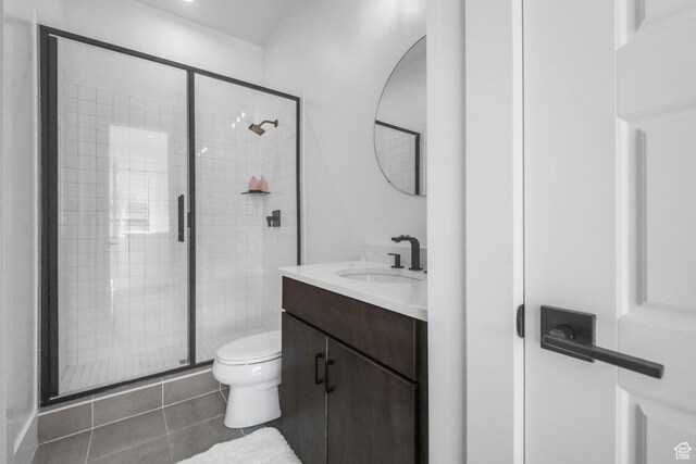 12277 S Emory Peak Cv Unit 404, Herriman, UT 84096 - bathroom with vanity, a shower stall, toilet, and tile patterned floors