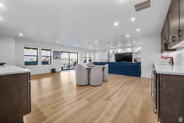 12277 S Emory Peak Cv Unit 404, Herriman, UT 84096 - living area with light wood-style flooring, recessed lighting, and baseboards
