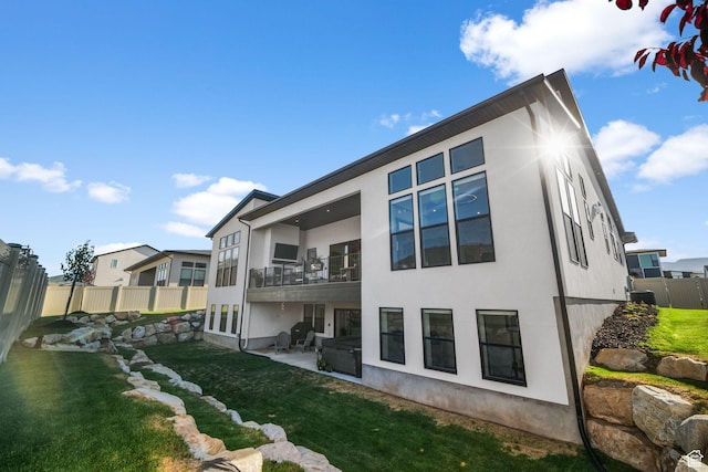 12277 S Emory Peak Cv Unit 404, Herriman, UT 84096 - back of house with a balcony, stucco siding, and a patio area