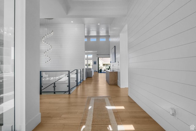 12277 S Emory Peak Cv Unit 404, Herriman, UT 84096 - hall featuring wood finished floors, wooden walls, an upstairs landing, and recessed lighting