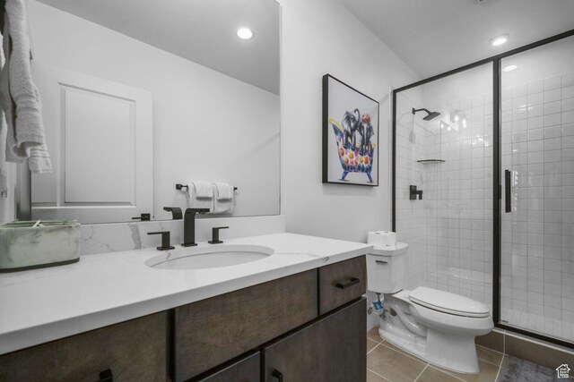 12277 S Emory Peak Cv Unit 404, Herriman, UT 84096 - full bathroom featuring vanity, toilet, a shower stall, tile patterned flooring, and recessed lighting