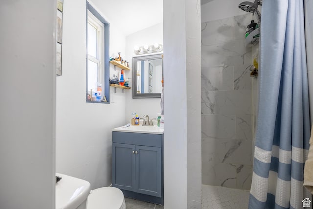 389 E 200 N, Spanish Fork, UT 84660 - bathroom featuring a marble finish shower, vanity, and toilet