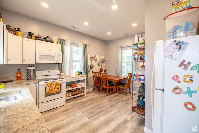 389 E 200 N, Spanish Fork, UT 84660 - kitchen featuring white appliances, light wood-style floors, white cabinetry, recessed lighting, and healthy amount of natural light