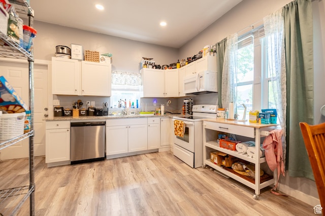 389 E 200 N, Spanish Fork, UT 84660 - kitchen with white appliances, light wood finished floors, a sink, recessed lighting, and white cabinetry