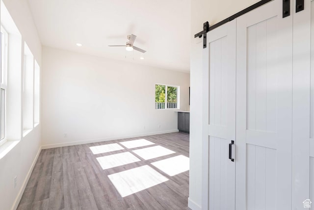 155 N 800 W, Vernal, UT 84078 - spare room featuring wood finished floors, ceiling fan, a barn door, and recessed lighting