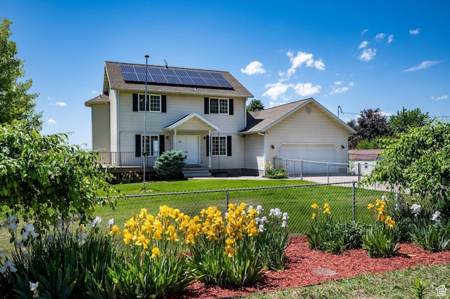 2951 N 1200 E, North Logan, UT 84341 - colonial house featuring solar panels, a garage, a shingled roof, and driveway