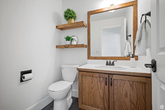 2951 N 1200 E, North Logan, UT 84341 - bathroom with vanity, baseboards, toilet, and wood finished floors