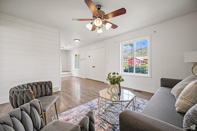 2951 N 1200 E, North Logan, UT 84341 - living room featuring wood finished floors, baseboards, and ceiling fan