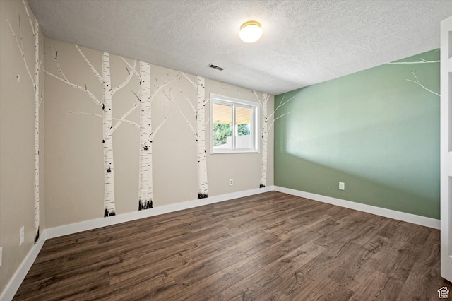 2951 N 1200 E, North Logan, UT 84341 - unfurnished room featuring wood finished floors, a textured ceiling, and baseboards