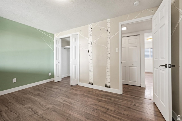 2951 N 1200 E, North Logan, UT 84341 - unfurnished bedroom featuring wood finished floors, baseboards, and a textured ceiling