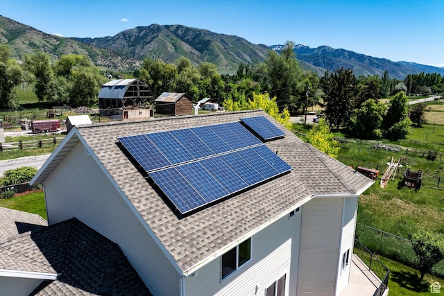 2951 N 1200 E, North Logan, UT 84341 - view of home's exterior with roof with shingles, solar panels, and a mountain view