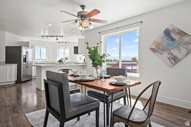 2951 N 1200 E, North Logan, UT 84341 - dining space with a ceiling fan, dark wood-type flooring, and baseboards