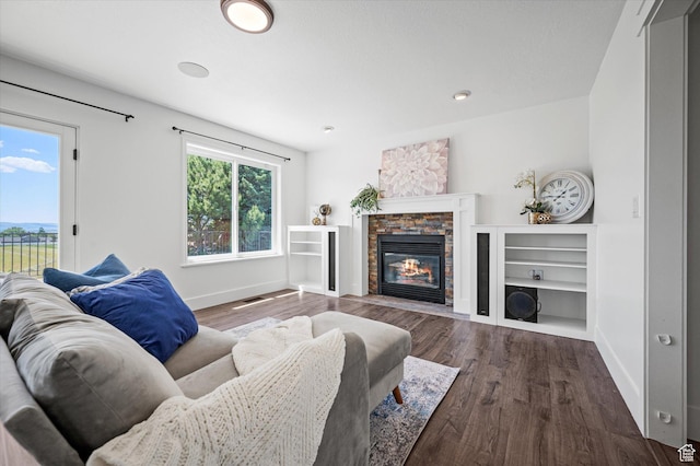 2951 N 1200 E, North Logan, UT 84341 - living room featuring baseboards, wood finished floors, and a fireplace