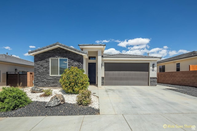 3482 W 150th St N, Hurricane, UT 84737 - view of front facade featuring stone siding, an attached garage, driveway, and a tiled roof