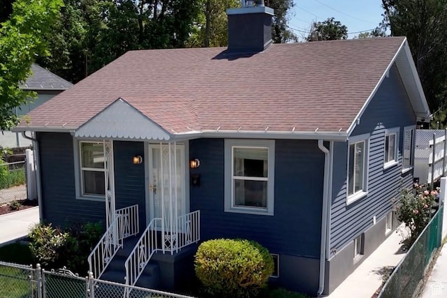 1114 E Wilson Ave S, Salt Lake City, UT 84105 - view of front of property with a chimney and a shingled roof