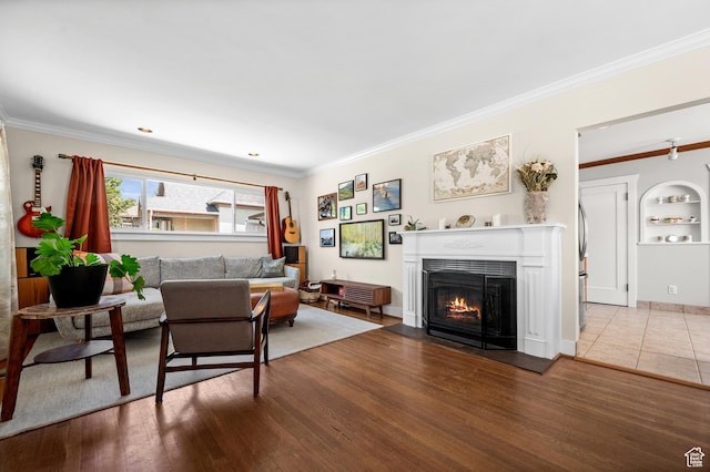 1114 E Wilson Ave S, Salt Lake City, UT 84105 - living room with a fireplace with flush hearth, ornamental molding, and wood finished floors
