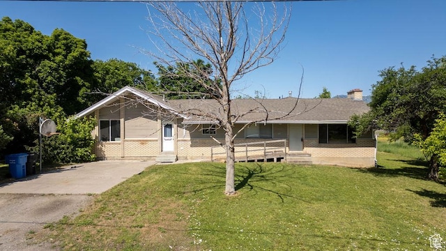 8765 S 300 W, Paradise, UT 84328 - view of front of property with brick siding, a front lawn, driveway, and a chimney