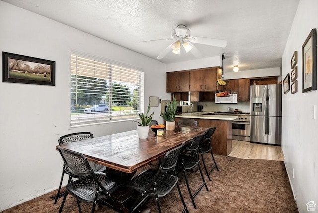 8765 S 300 W, Paradise, UT 84328 - dining area with ceiling fan, a textured ceiling, and light carpet
