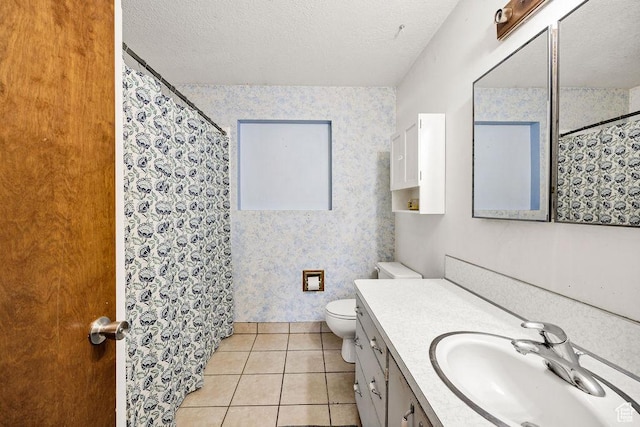 8765 S 300 W, Paradise, UT 84328 - bathroom with wallpapered walls, toilet, vanity, a textured ceiling, and tile patterned floors