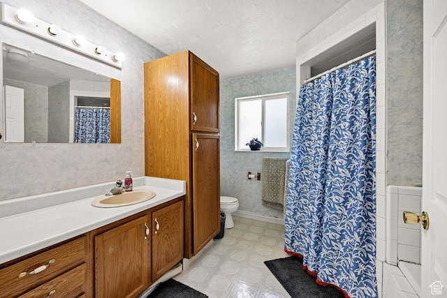 8765 S 300 W, Paradise, UT 84328 - full bath featuring vanity, toilet, tile patterned floors, curtained shower, and a textured ceiling