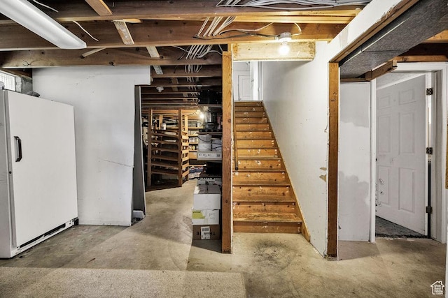 8765 S 300 W, Paradise, UT 84328 - unfinished basement featuring freestanding refrigerator and stairway