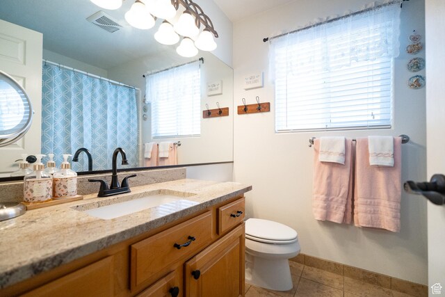 1825 W Mathis Park Pl Unit 13, St George, UT 84770 - bathroom with vanity, tile patterned flooring, toilet, and baseboards