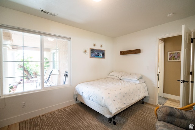 1825 W Mathis Park Pl Unit 13, St George, UT 84770 - bedroom featuring baseboards and multiple windows