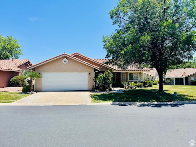 1825 W Mathis Park Pl Unit 13, St George, UT 84770 - single story home with driveway, an attached garage, stucco siding, a front lawn, and a tiled roof