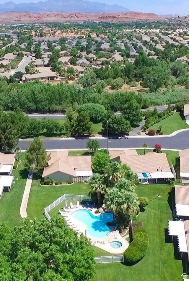 1825 W Mathis Park Pl Unit 13, St George, UT 84770 - aerial perspective of suburban area featuring a pool area and a mountainous background