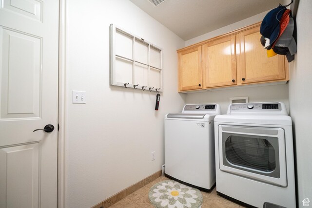 1825 W Mathis Park Pl Unit 13, St George, UT 84770 - washroom featuring cabinet space, washer and dryer, and baseboards