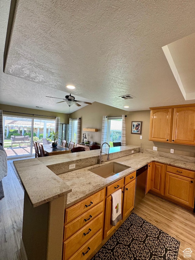 1825 W Mathis Park Pl Unit 13, St George, UT 84770 - kitchen featuring a sink, stainless steel dishwasher, a textured ceiling, light wood finished floors, and a peninsula