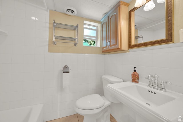 2967 E Branch Dr S, Holladay, UT 84117 - bathroom with toilet, tile walls, a sink, a tub to relax in, and a shower